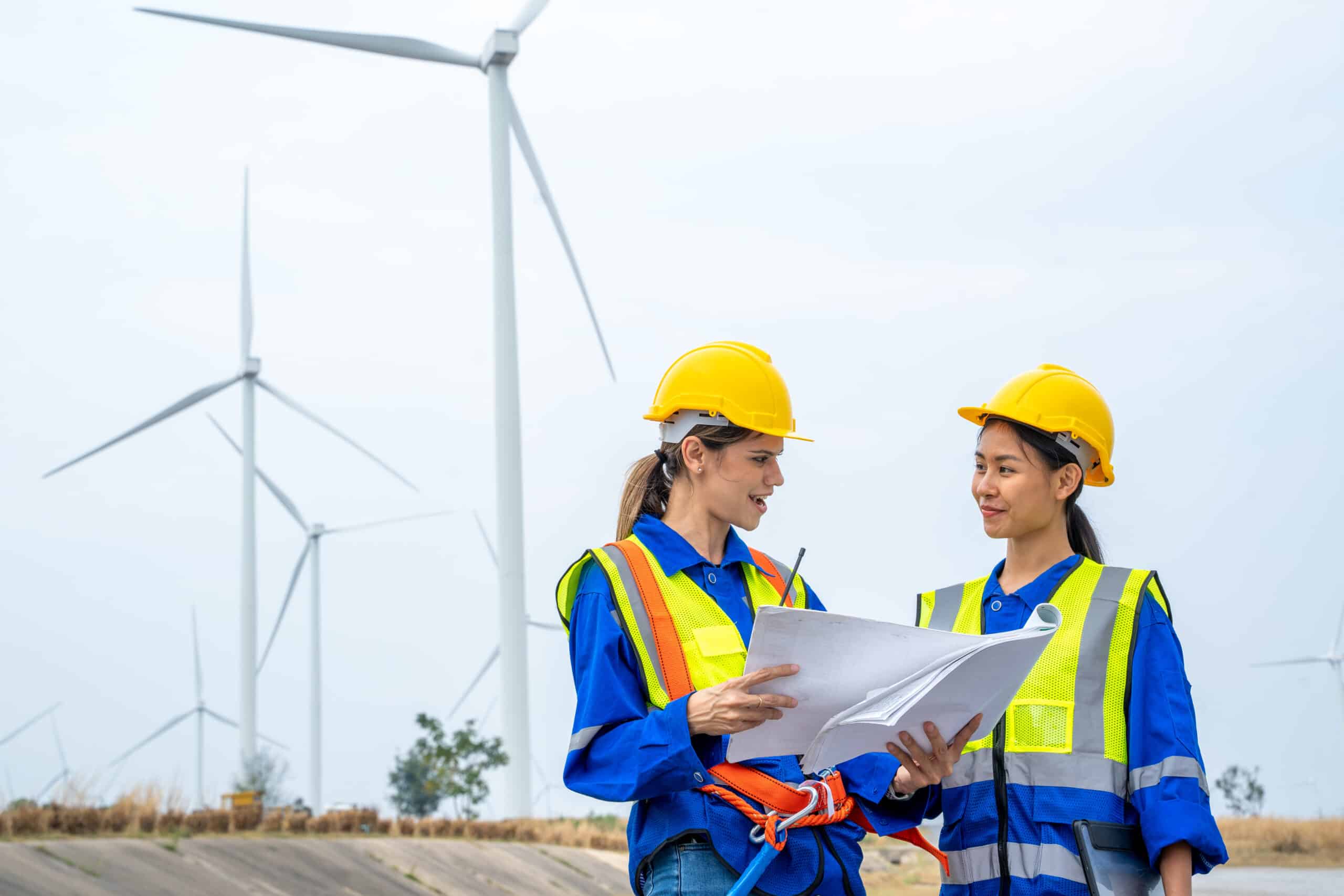 Wind turbine engineer,Engineer maintains and controls wind turbine energy generation on wind turbine farm,Concept of sustainable future.