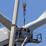 wind energy technicians repairing turbine