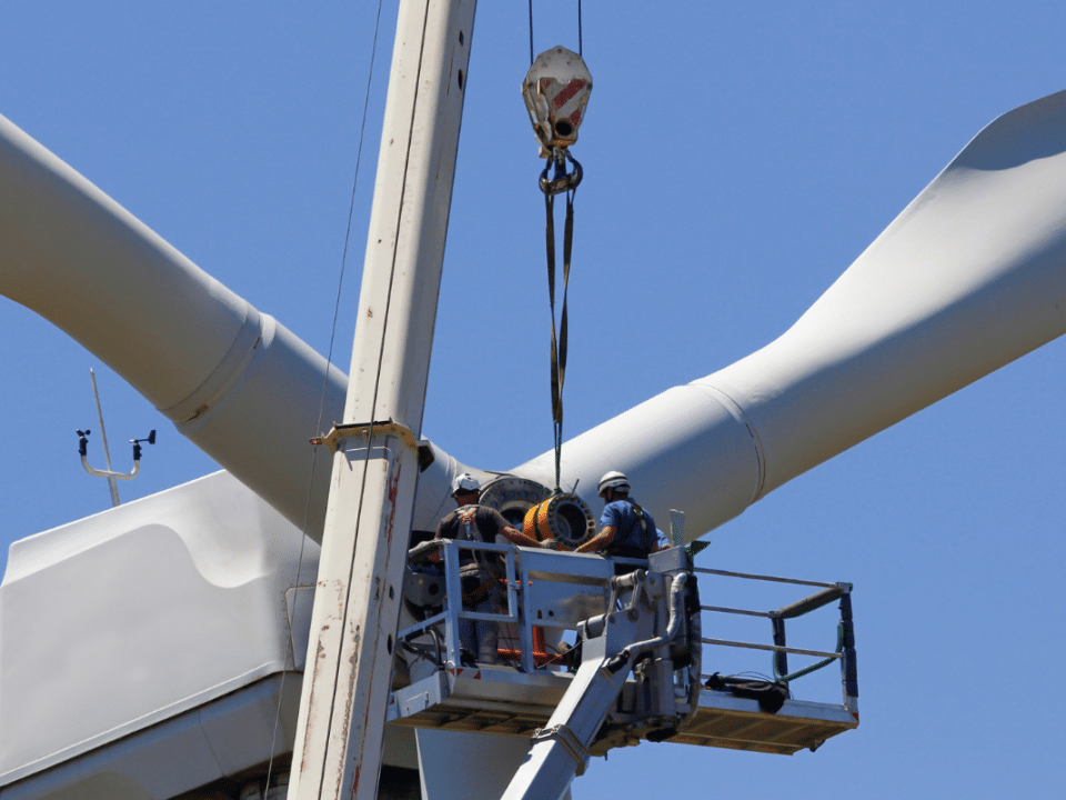 wind energy technicians repairing turbine