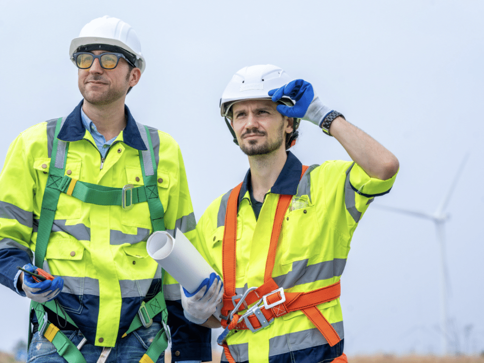 two male wind turbine technicians in gear