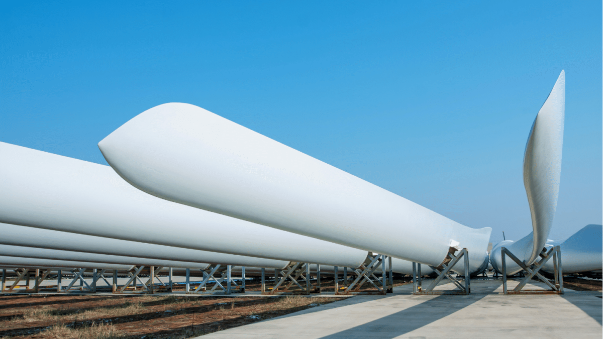 New Wind turbine blades lined up on ground