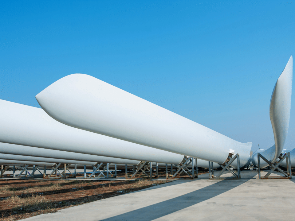 New Wind turbine blades lined up on ground