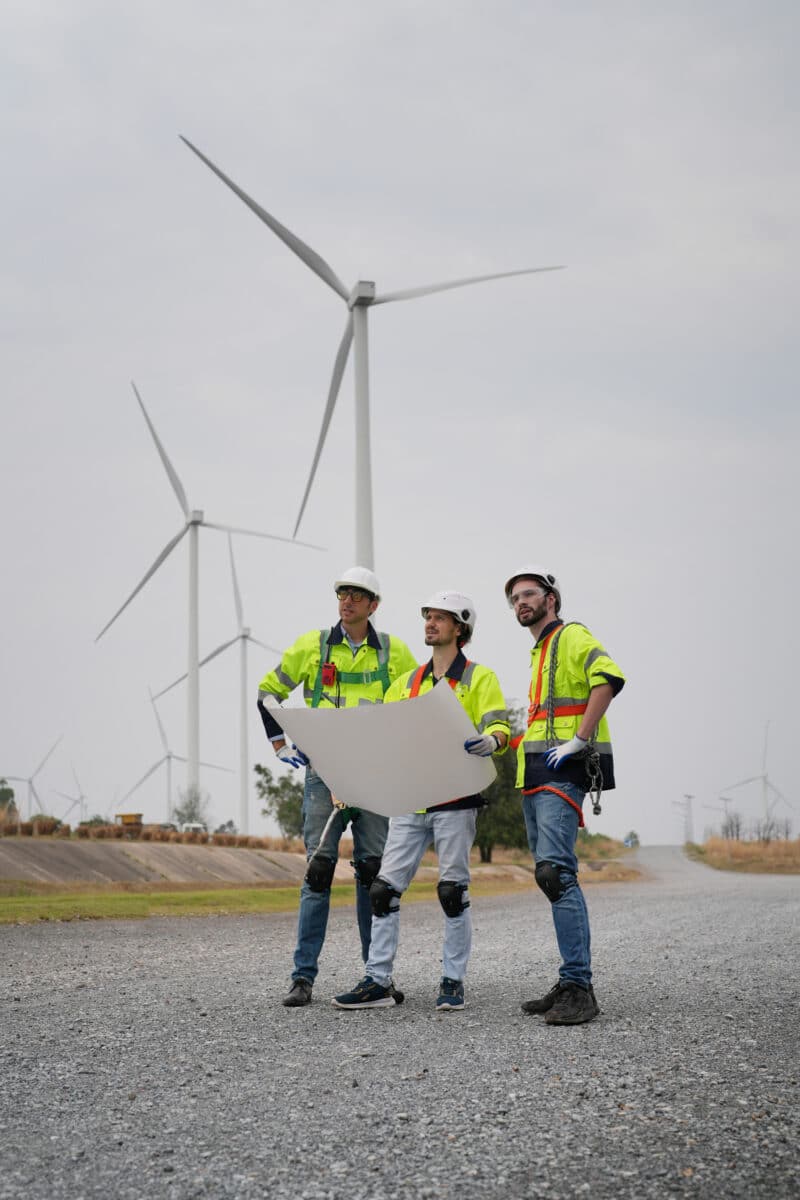 wind turbine experts working on plans for wind turbines