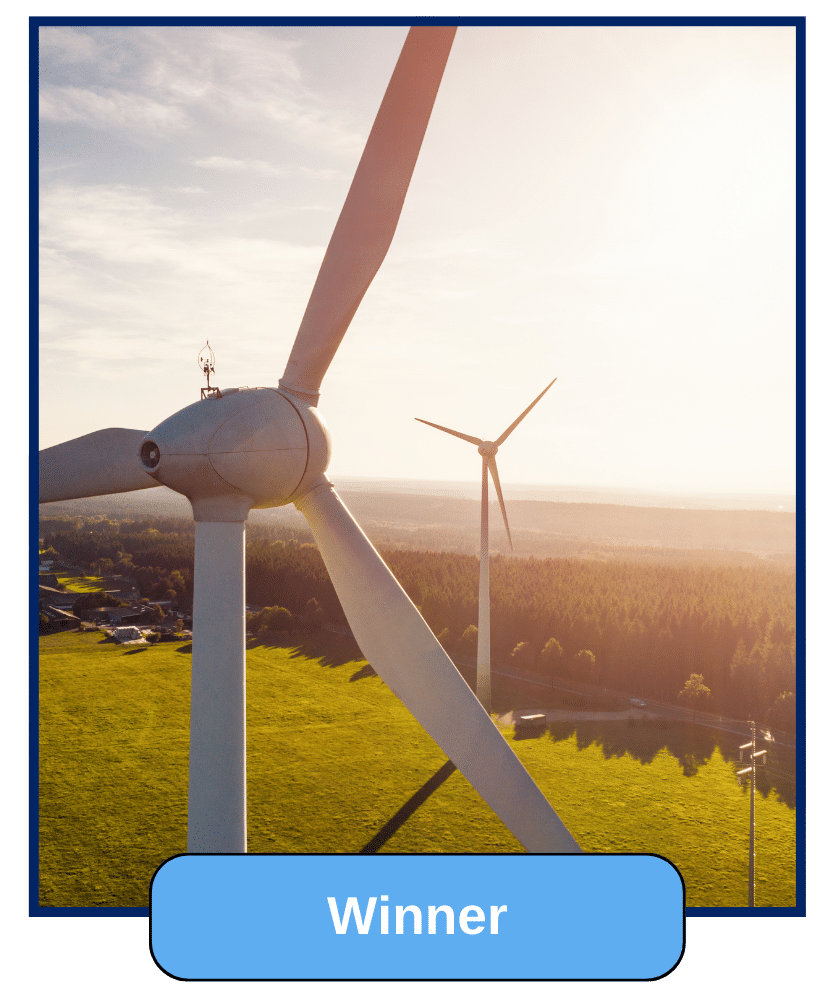 A close-up of a large wind turbine generating electricity in the countryside.