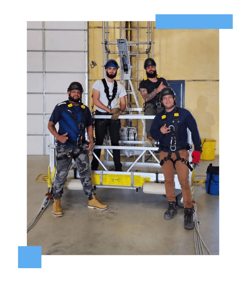 Wind Trade Academy students wearing safety harnesses after completing GWO Certification training