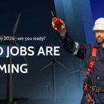 Wind technician signaling on a wind farm highlighting booming wind jobs