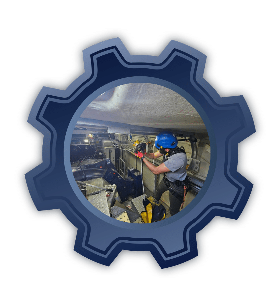Maintenance worker in blue helmet secured with a harness, inspecting equipment inside a mechanical workspace framed by a gear icon