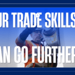 Worker in safety gear adjusting ropes on a wind turbine, overlaid with bold slogan and WindTrade Academy logo on the right.